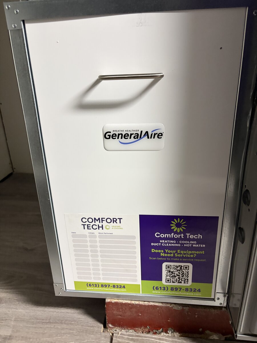 GeneralAire whole-home humidifier with Comfort Tech service sticker